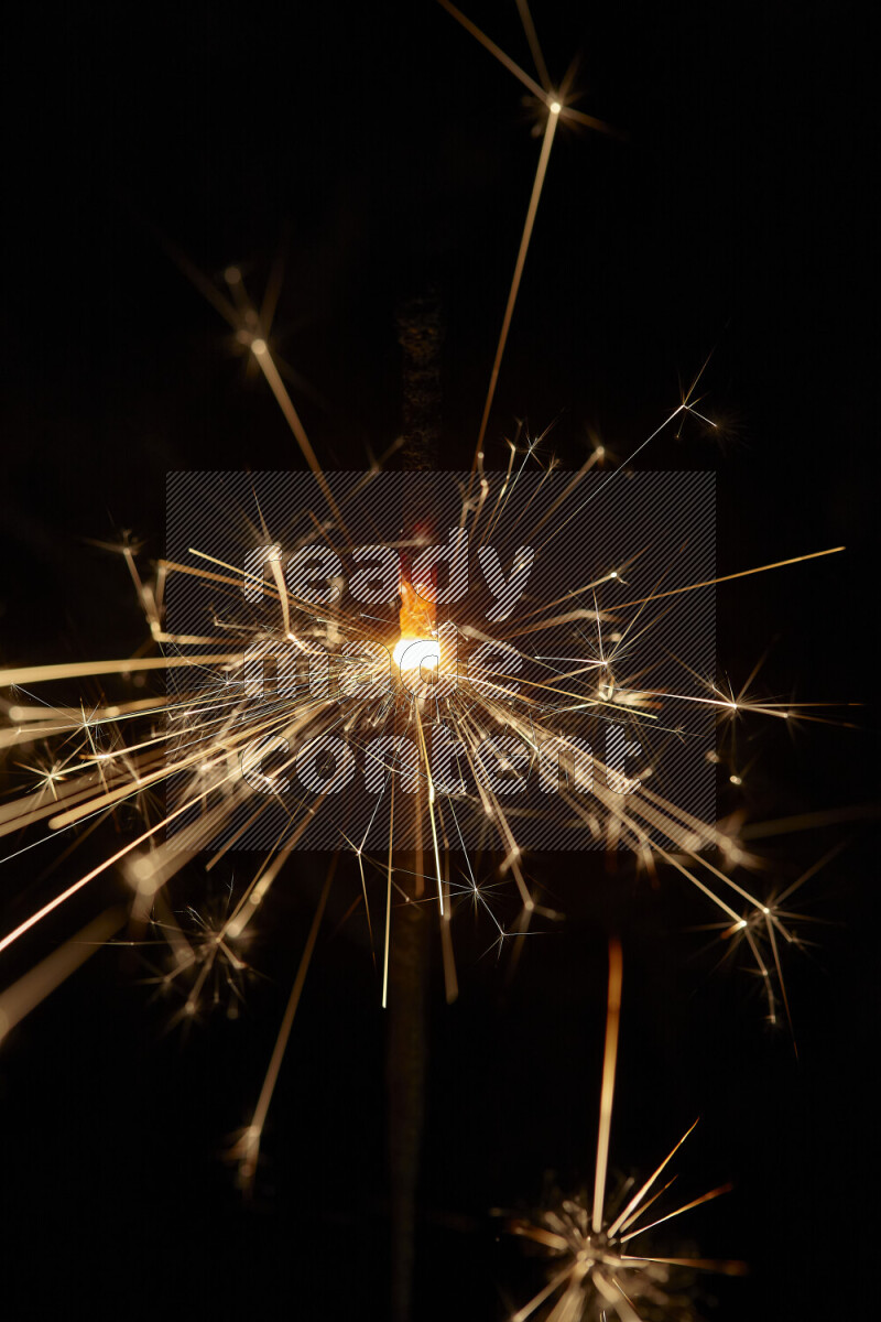A close-up image of sparkler candle isolated on black background