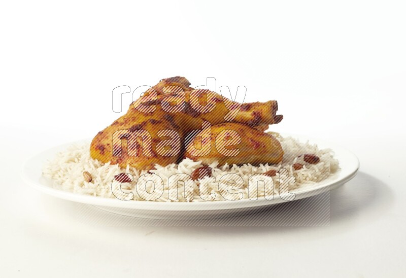 white  basmati Rice with  kabsa chicken pieces  on a white rounded plate direct on white background