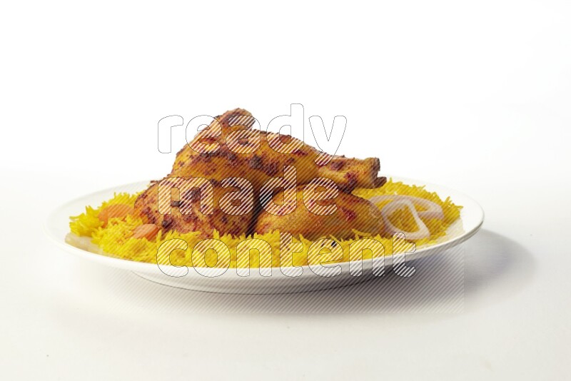 yellow basmati Rice with kabsa chicken pieces on a white rounded plate direct on white background