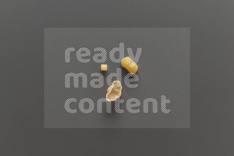 Different pasta types on grey background