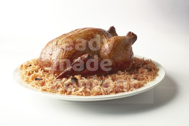 red basmati Rice with  whole roasted chicken on a white rounded plate  direct  on white background