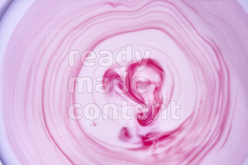 A close-up of abstract swirling patterns in red and white