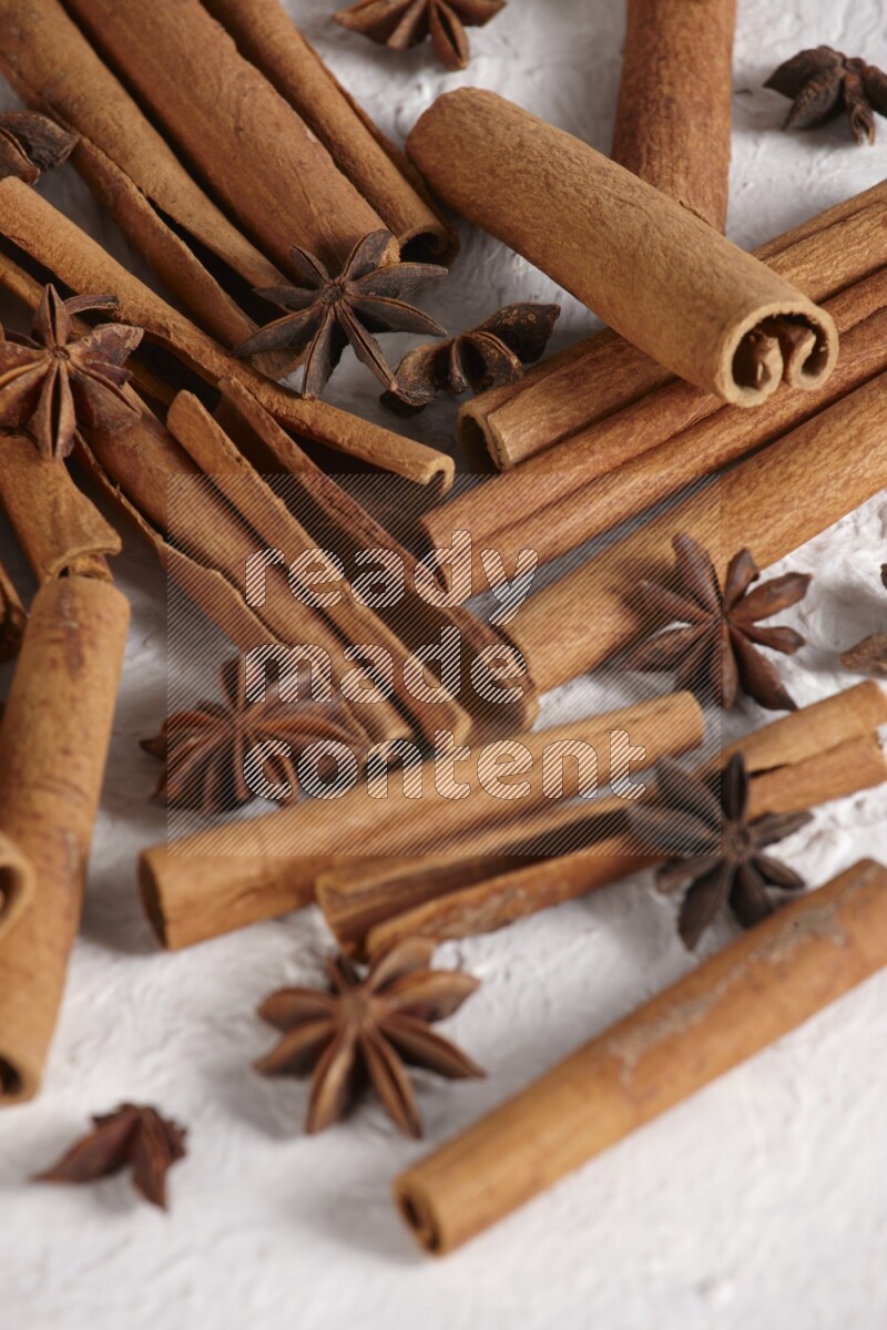 cinnamon sticks with star anise on white background