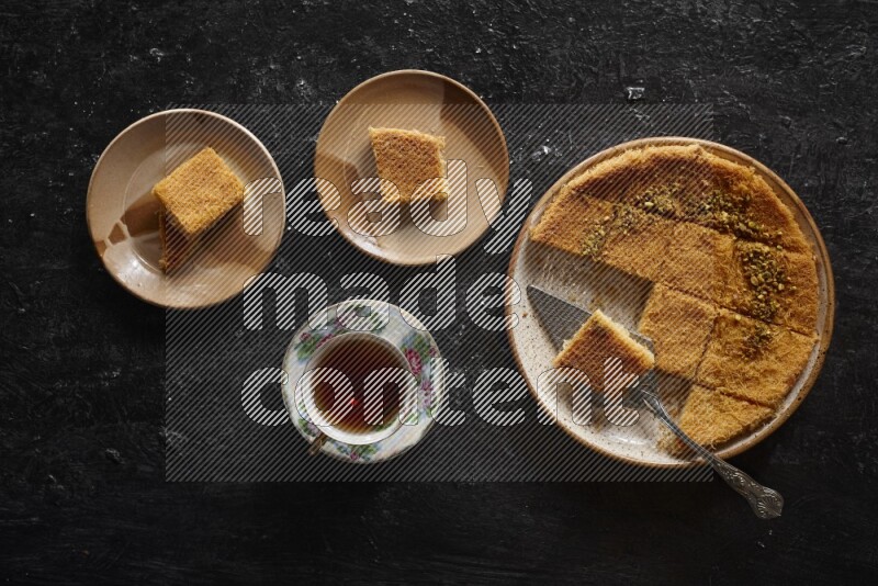 konafa with tea in a dark setup
