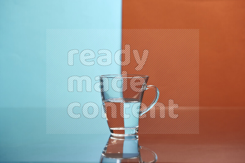 The image features a clear glassware filled with water, set against light blue and dark orange background
