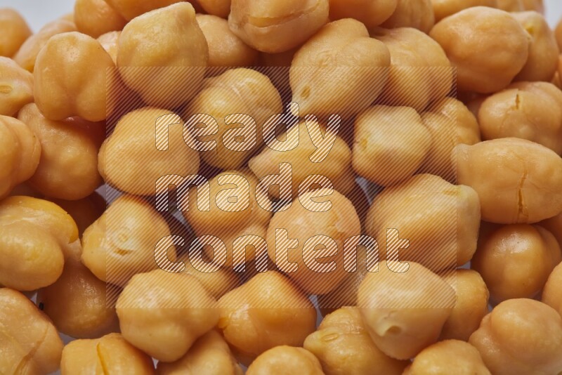 Close up shot of boiled chickpeas on white background