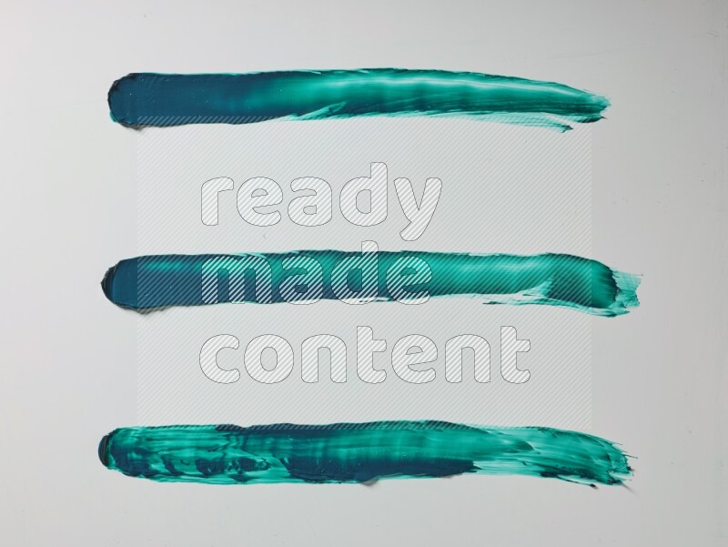 Turquoise painting knife strokes on white background