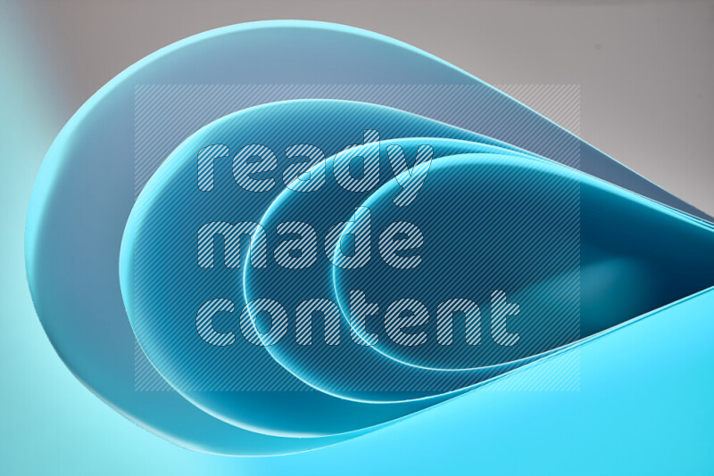 An abstract art of paper folded into smooth curves in blue gradients