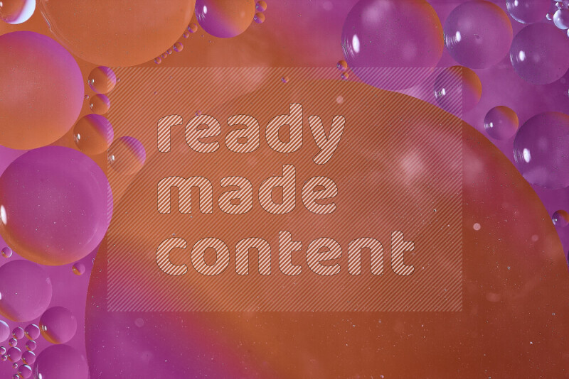 Close-ups of abstract oil bubbles on water surface in shades of orange and pink