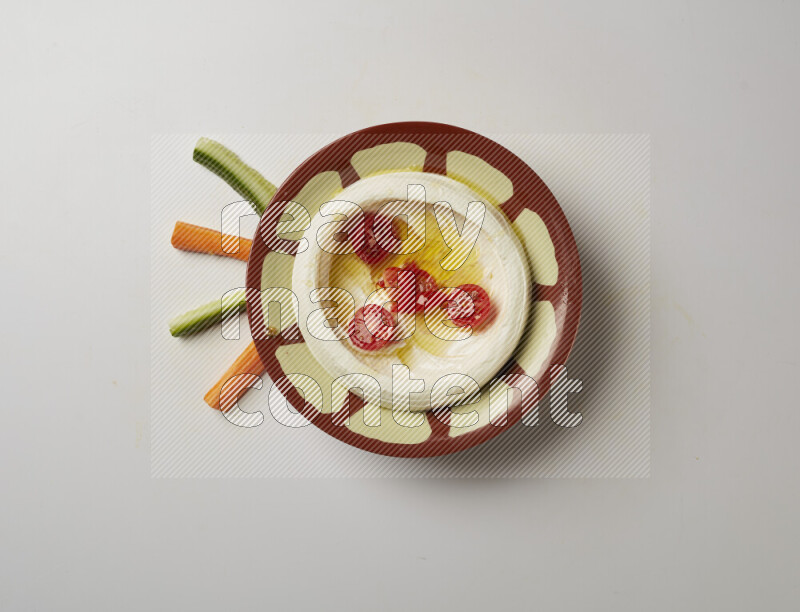 Lebnah garnished with Cherry tomato in a traditional plate on a white background