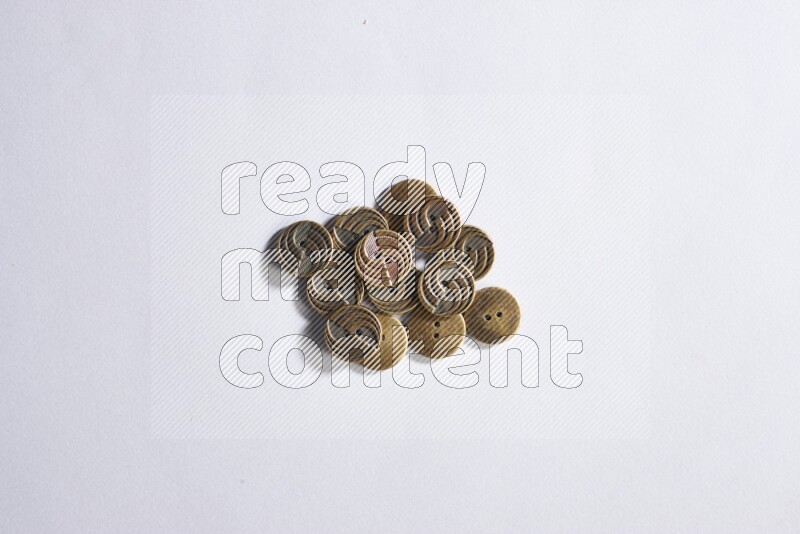 Metal buttons placed on grey background