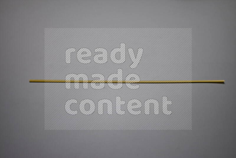 Linguini pasta on grey background