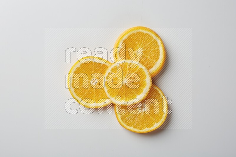 Four orange slices on a white background