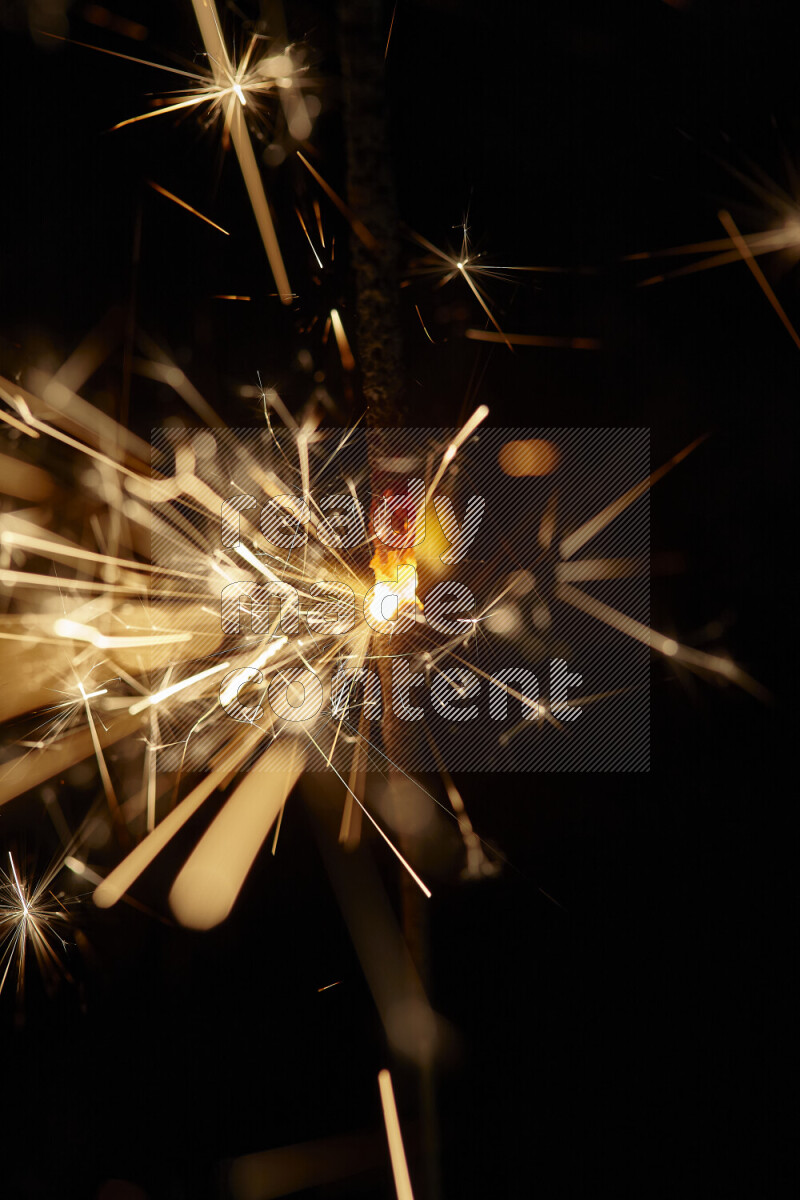 A close-up image of sparkler candle isolated on black background