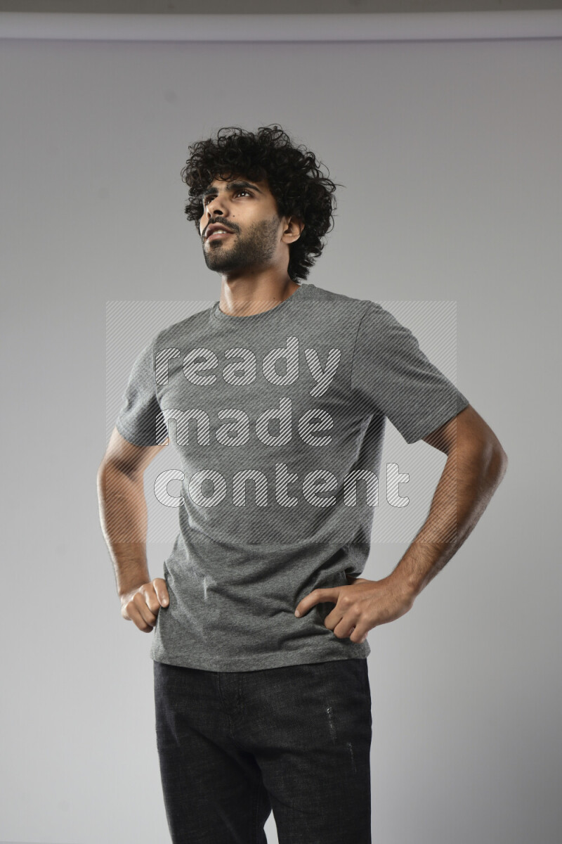 A man wearing casual standing and making a hand gesture on white background