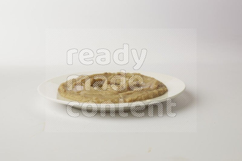 fava bean in a white plate direct on a white background