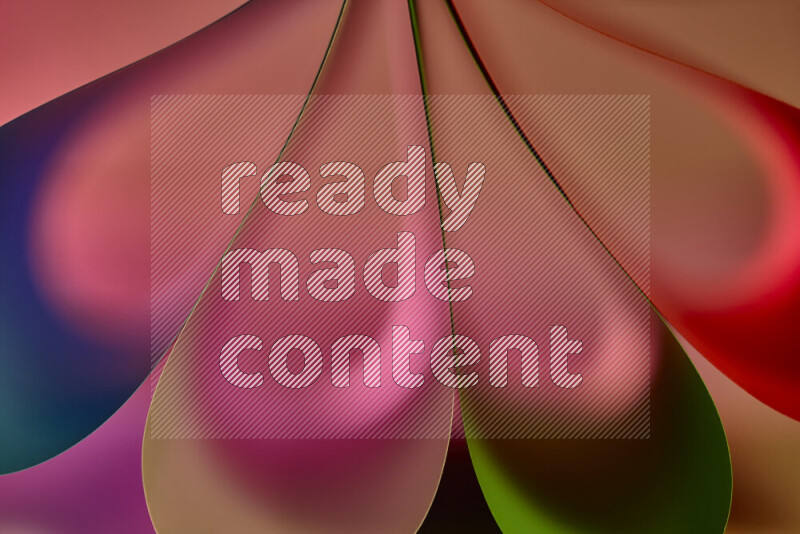 An abstract art piece displaying smooth curves in colorful gradients created by colored light