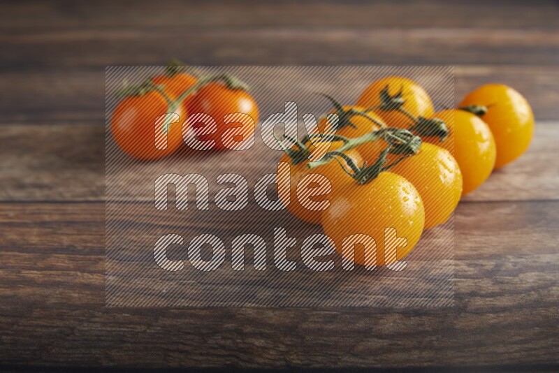 Mixed cherry tomato veins on a textured wooden background 45 degree