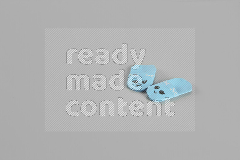 Origami slippers on grey background