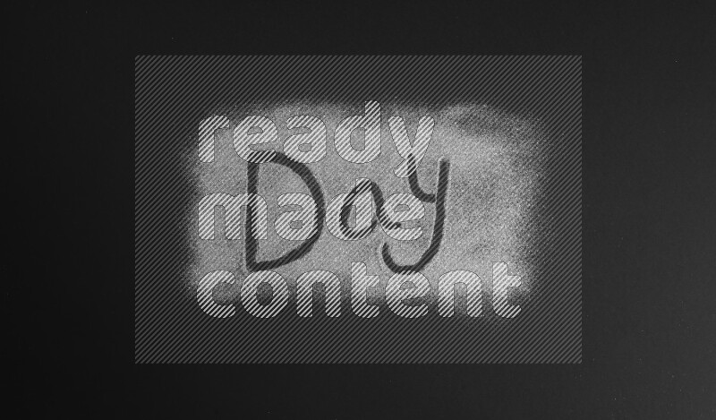 A word written with silver glitter on black background