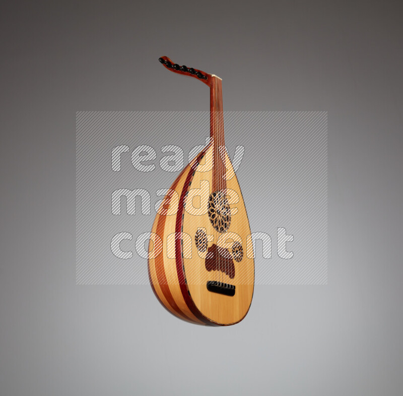a wooden brown Oud on a gray background