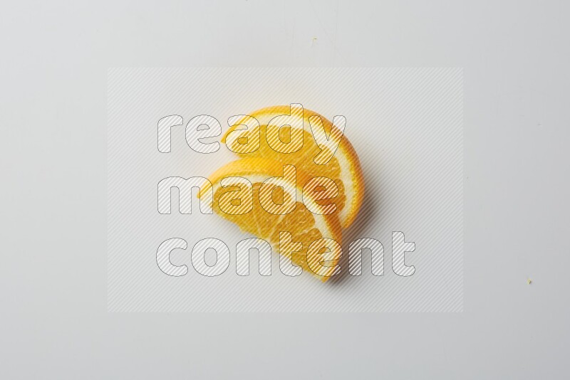Two halves of an orange slices on white background