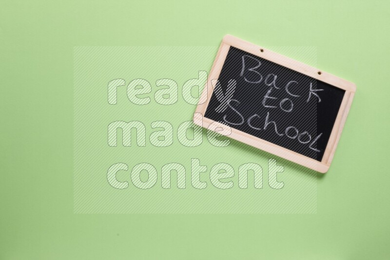 A blackboard on green background