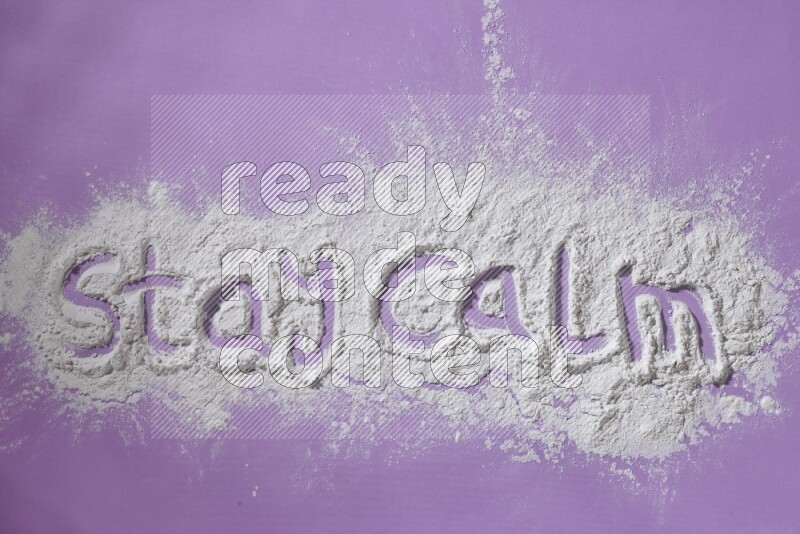 A sentence written with white powder on purple background