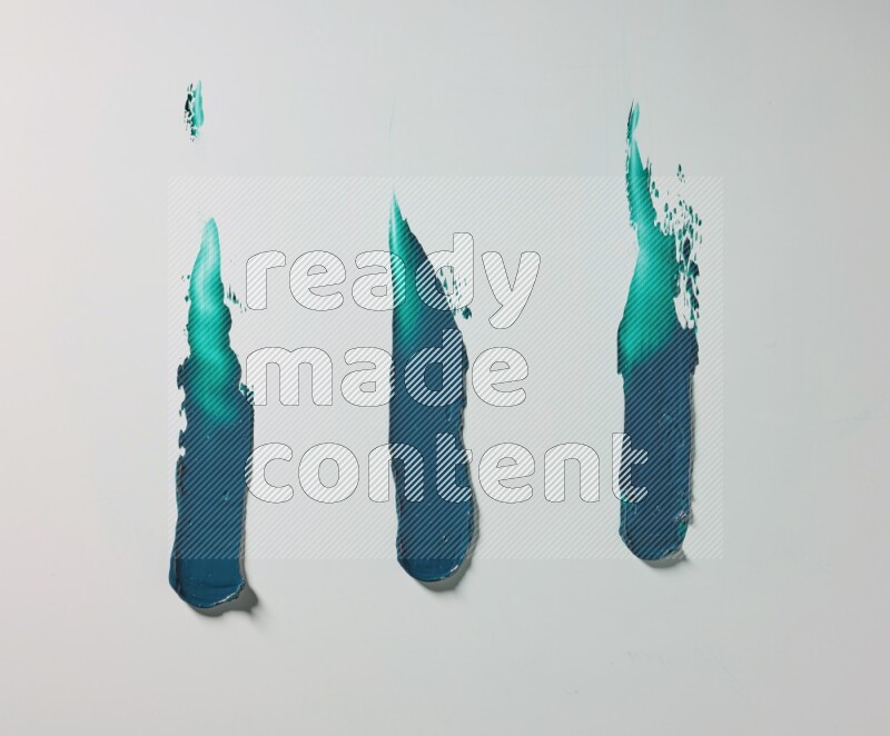 Turquoise painting knife strokes on white background