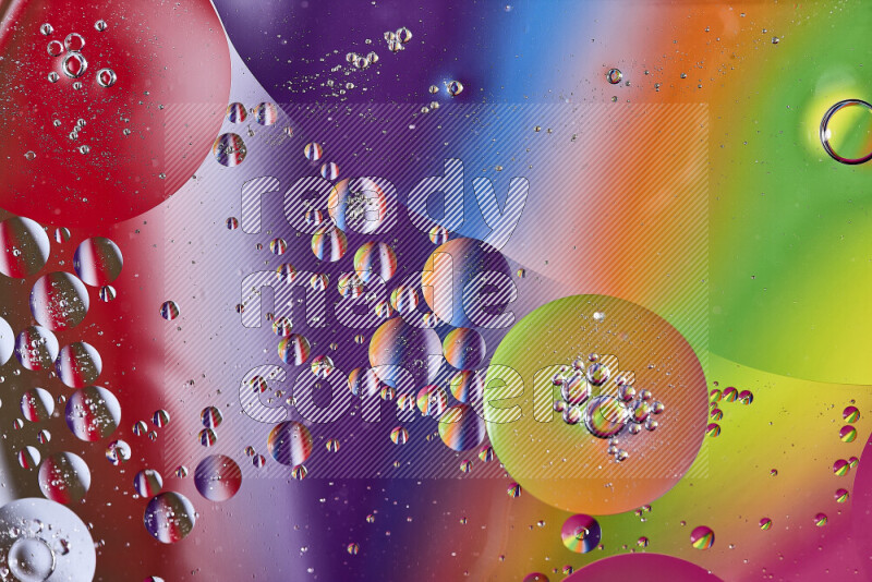 Close-ups of abstract oil bubbles on water surface in multicolors