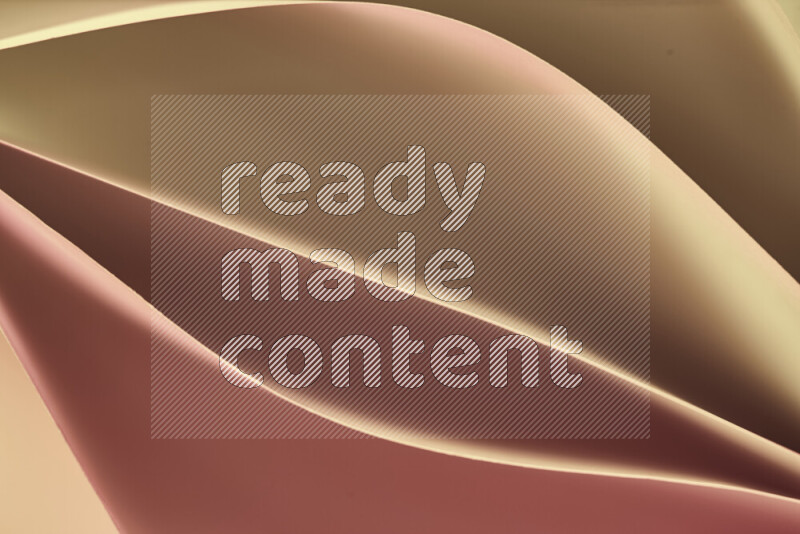 هذه الصورة تعرض تكوين فن الورق التجريدي مع منحنيات ورقية بتدرجات اللون الذهبي المكونه بواسطة الضوء الملون