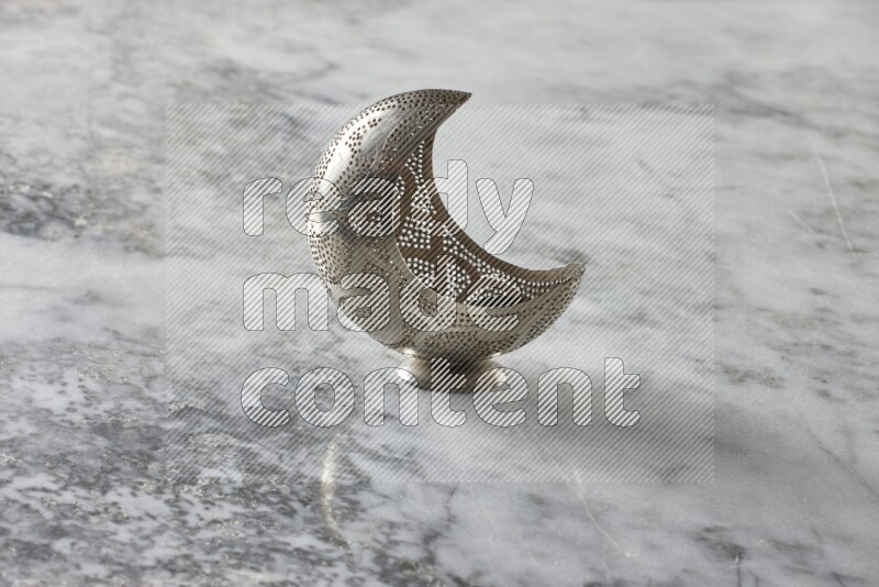 A lantern placed on a grey marble background