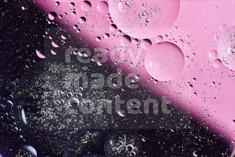 Close-ups of abstract oil bubbles on water surface in shades of purple and pink