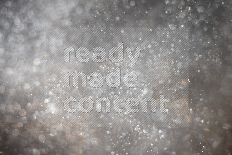 Silver glitter powder isolated on black background