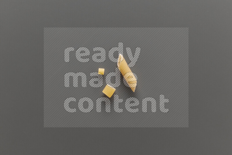 Different pasta types on grey background