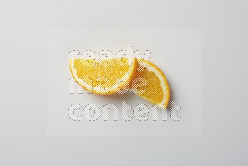 Two halves of an orange slices on white background