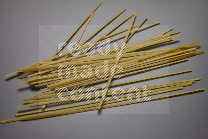 Linguini pasta on grey background