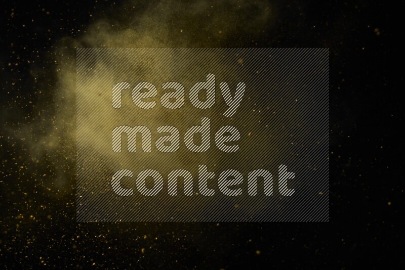 Yellow powder explosion on black background