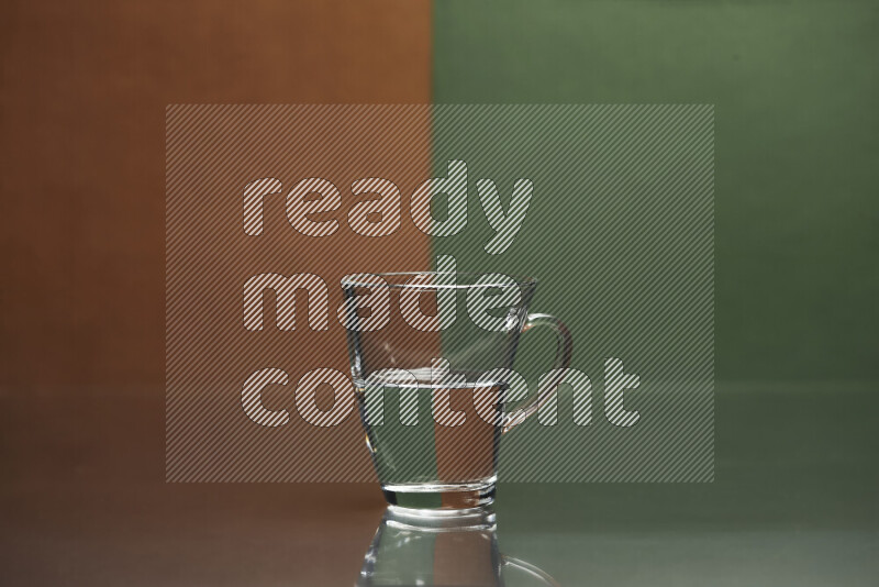 The image features a clear glassware filled with water, set against brown and dark green background