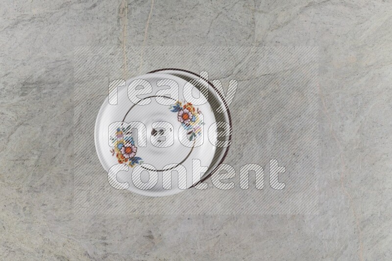 A vintage metal pot on grey marble background