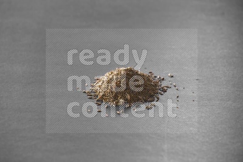 Cumin on a black flooring