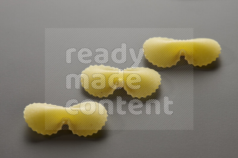 Fiocchi pasta on grey background