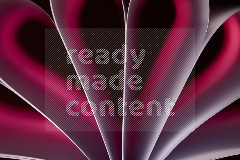 An abstract art piece displaying smooth curves in pink gradients created by colored light