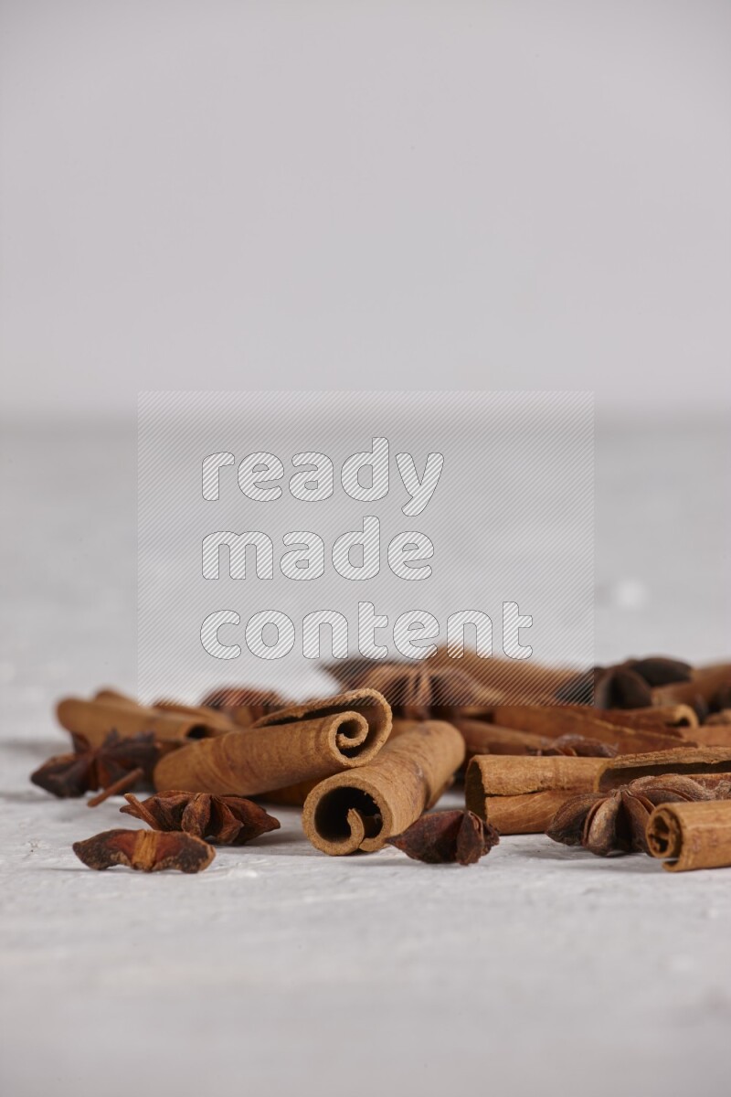 cinnamon sticks with star anise on white background