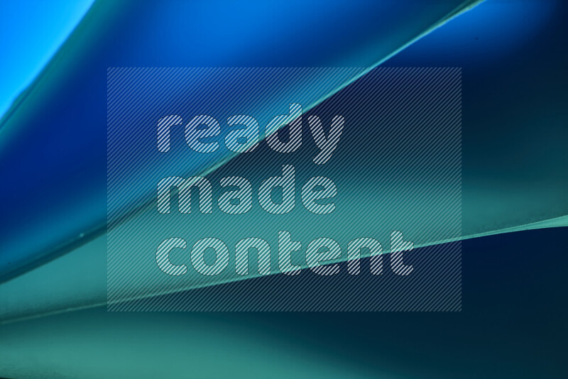 An abstract art piece displaying smooth curves in cold gradients created by colored light