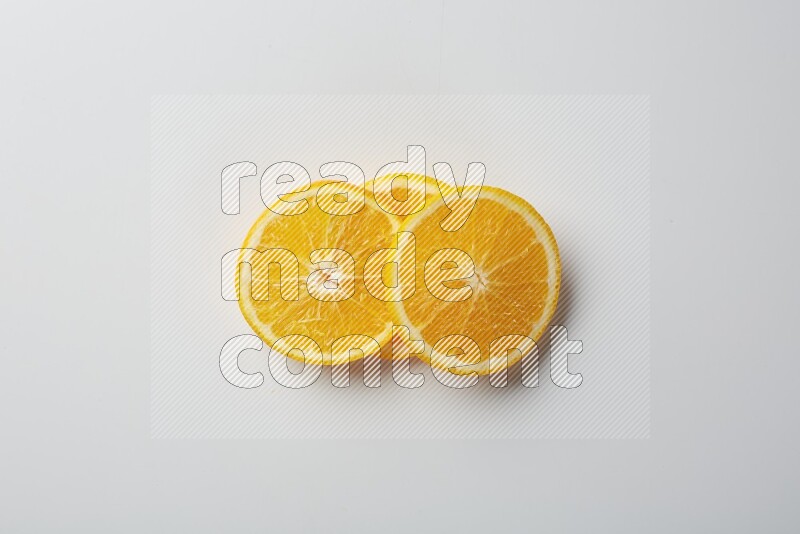 Three orange slices on a white background