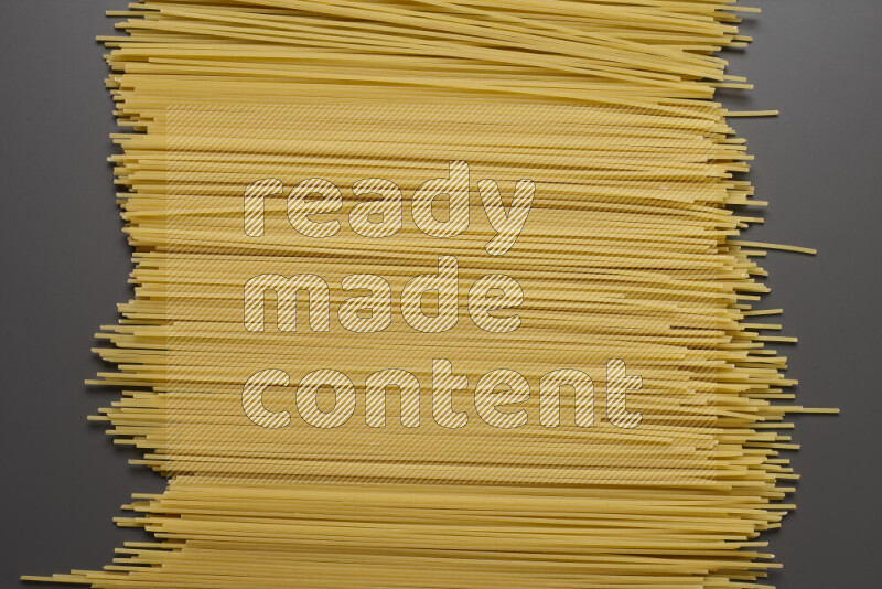 Spaghetti pasta on grey background