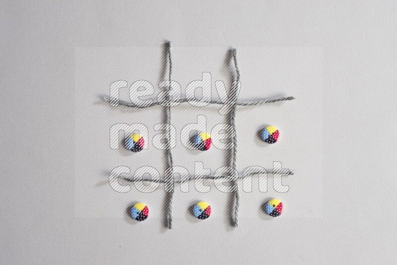 Multicolored buttons placed on grey background