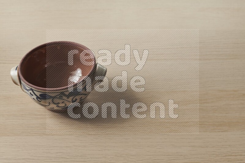 Multicolored Pottery Pot on Oak Wooden Flooring, 45 degrees