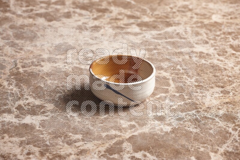 Multicolored Pottery Bowl on Beige Marble Flooring